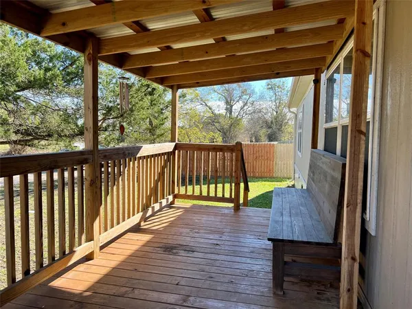 a view of porch with wooden floor