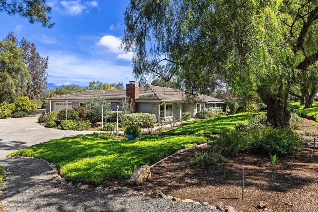 13928 Misty Oak Road Valley Center, CA 92082 - Photo 1 of 1 a front view of house with yard and green space
