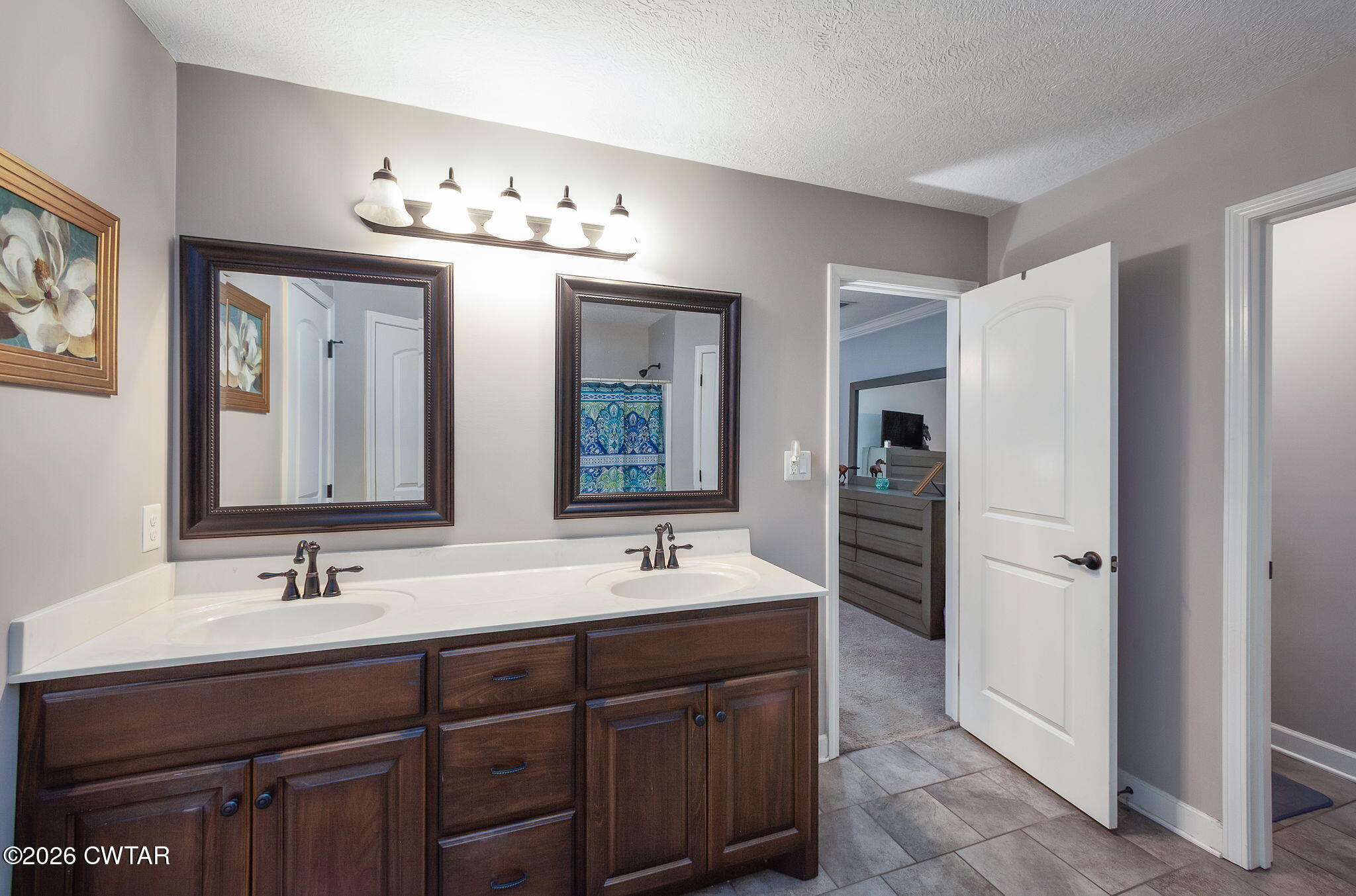 255 Taylor Drive Bells, TN 38006 - Photo 15 of 28 a bathroom with double vanity sinks a vanity a lamp and a mirror