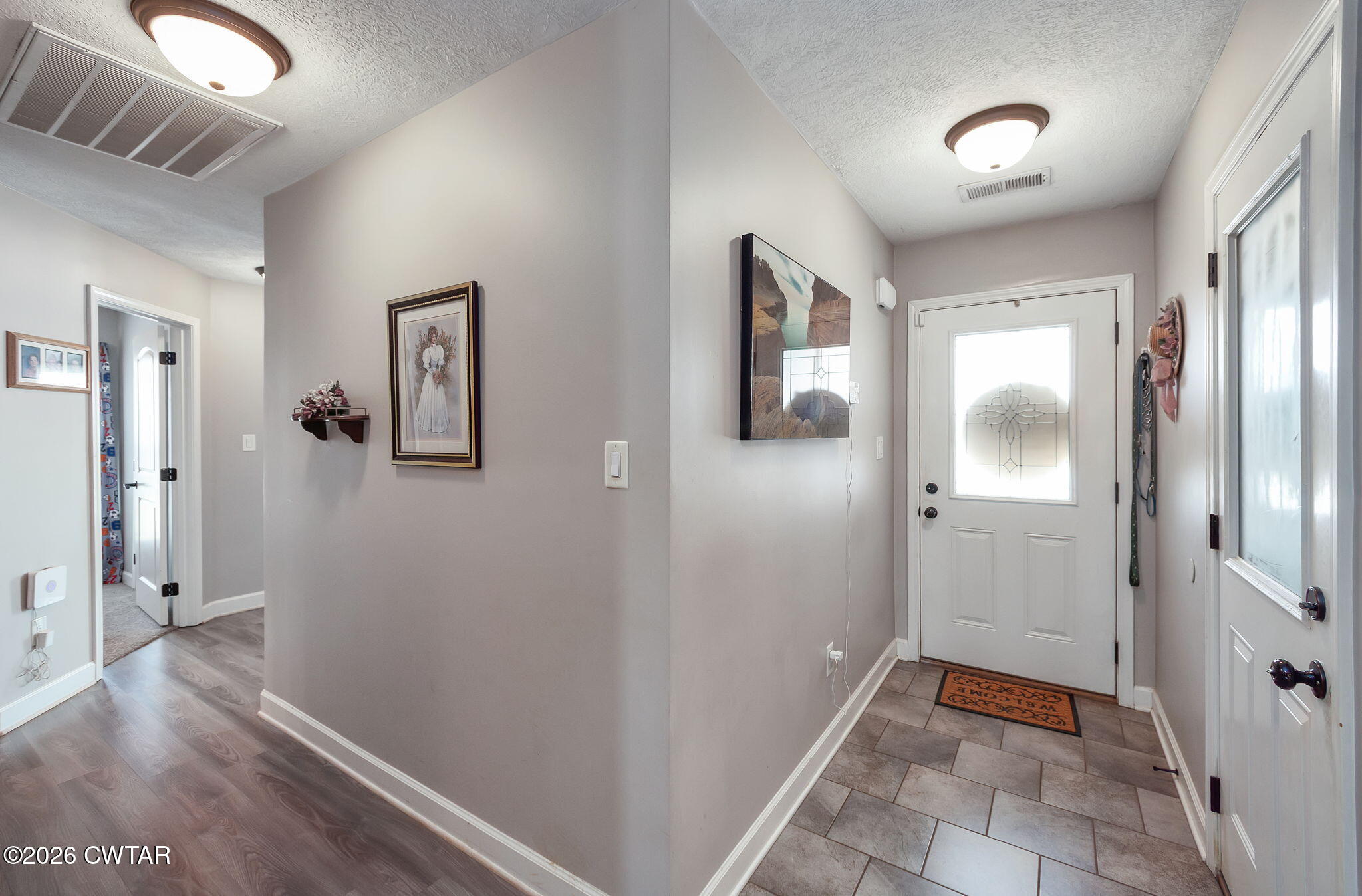 255 Taylor Drive Bells, TN 38006 - Photo 16 of 28 a view of a hallway with wooden floor