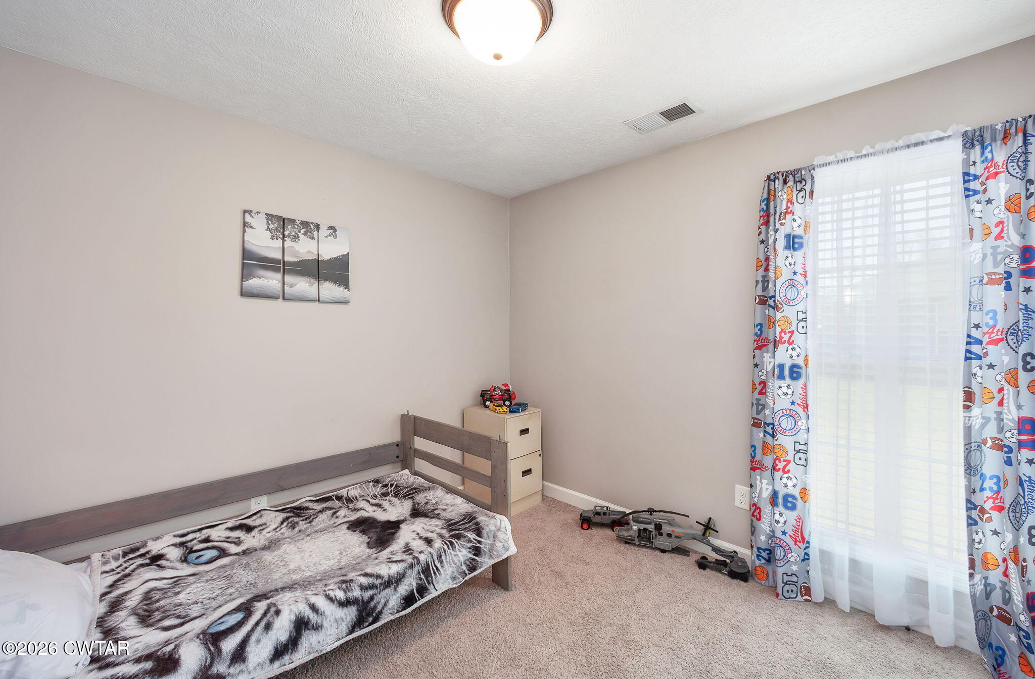 255 Taylor Drive Bells, TN 38006 - Photo 17 of 28 a bedroom with bed and a window
