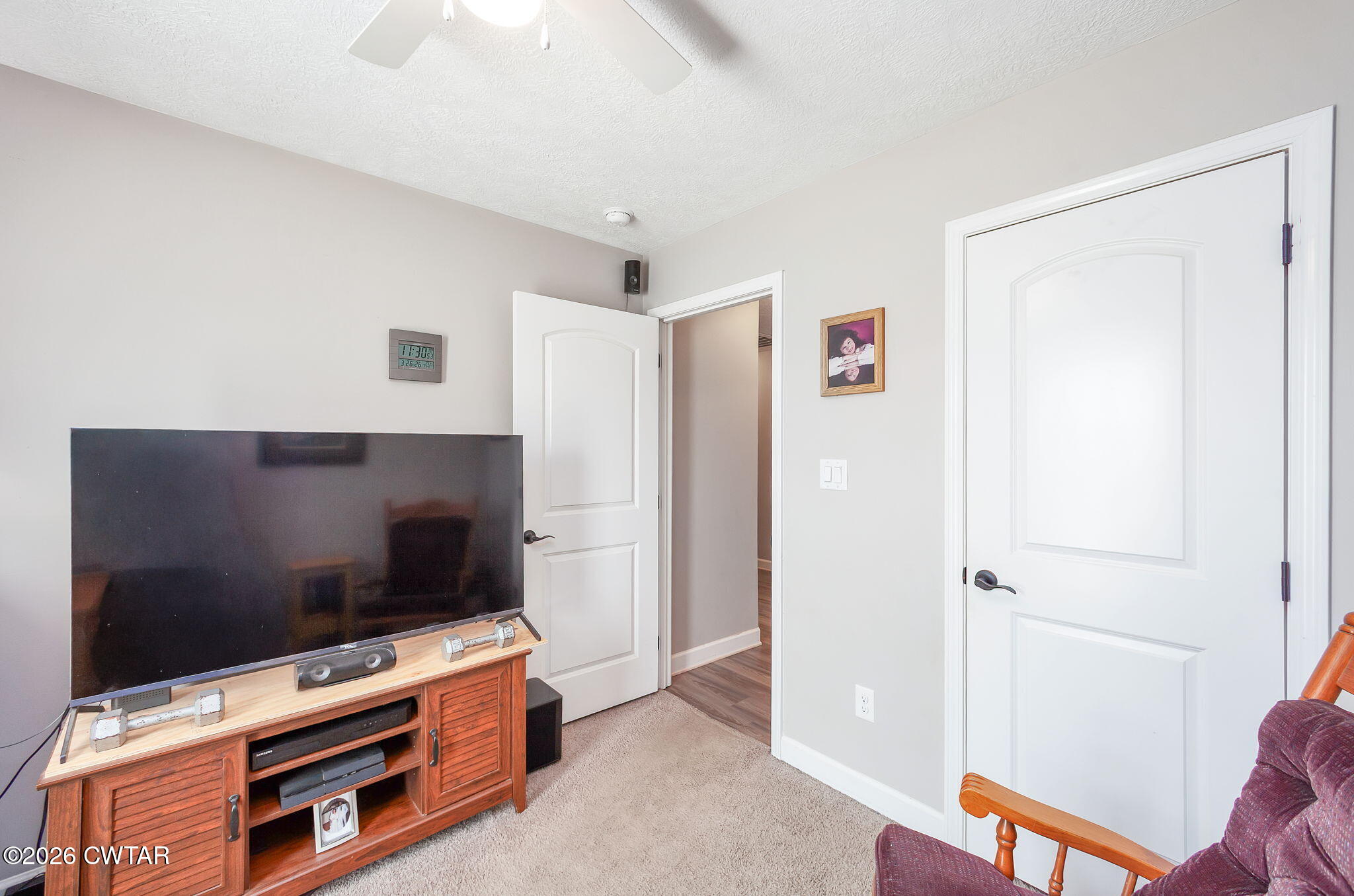 255 Taylor Drive Bells, TN 38006 - Photo 20 of 28 a living room with furniture and a flat screen tv