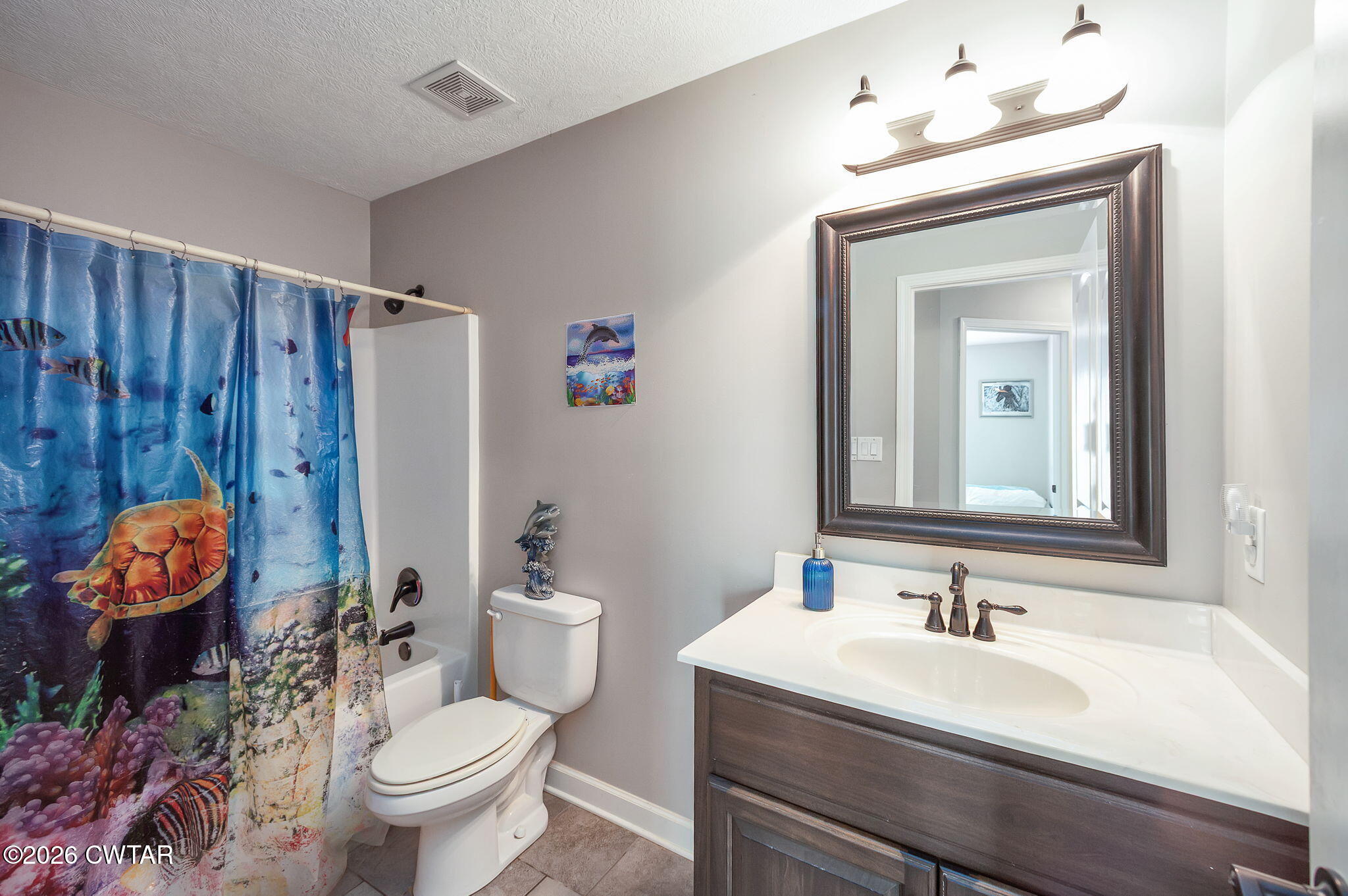 255 Taylor Drive Bells, TN 38006 - Photo 23 of 28 a bathroom with a granite countertop sink mirror vanity and toilet