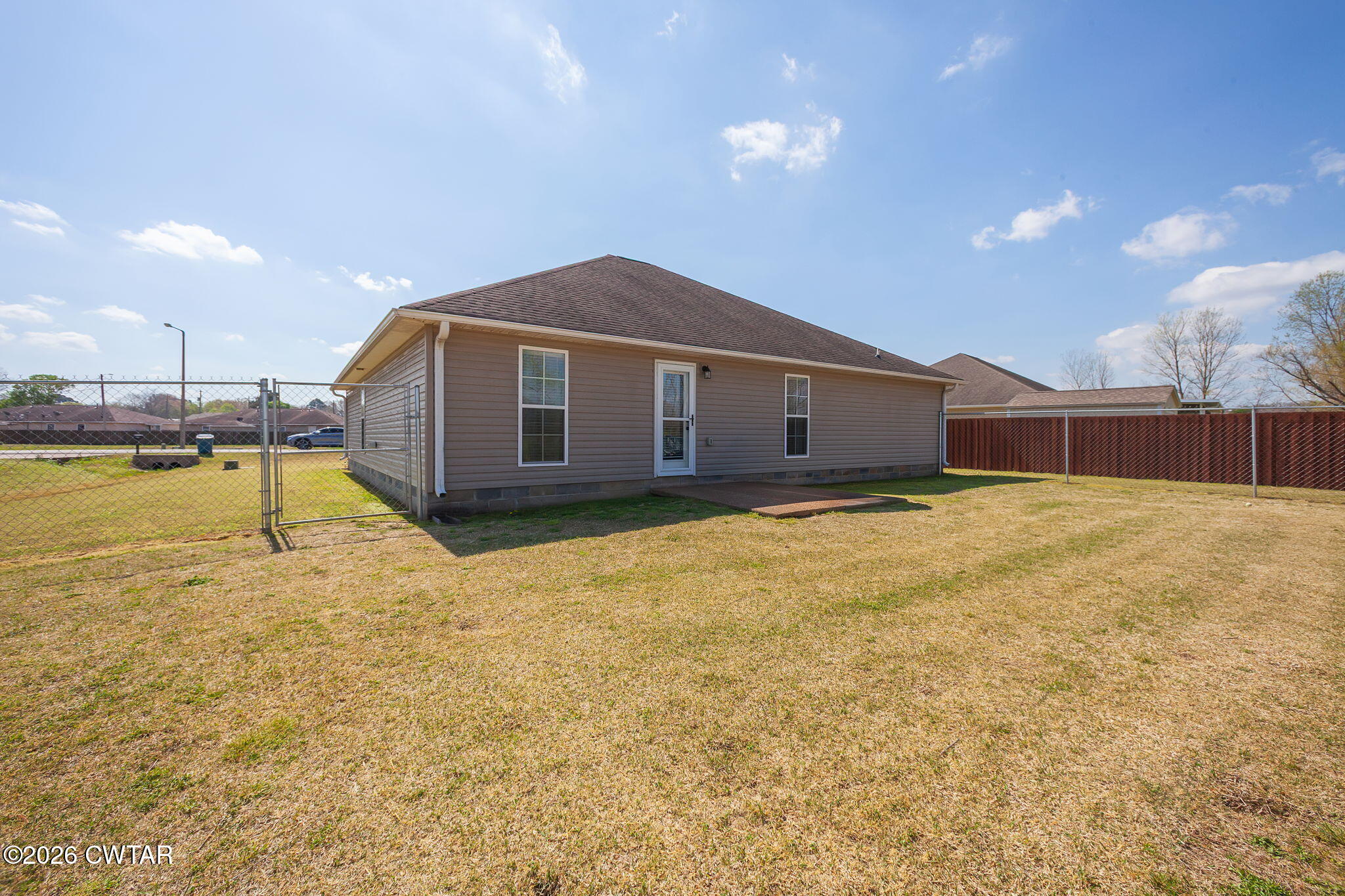 255 Taylor Drive Bells, TN 38006 - Photo 25 of 28 a view of a house with a yard