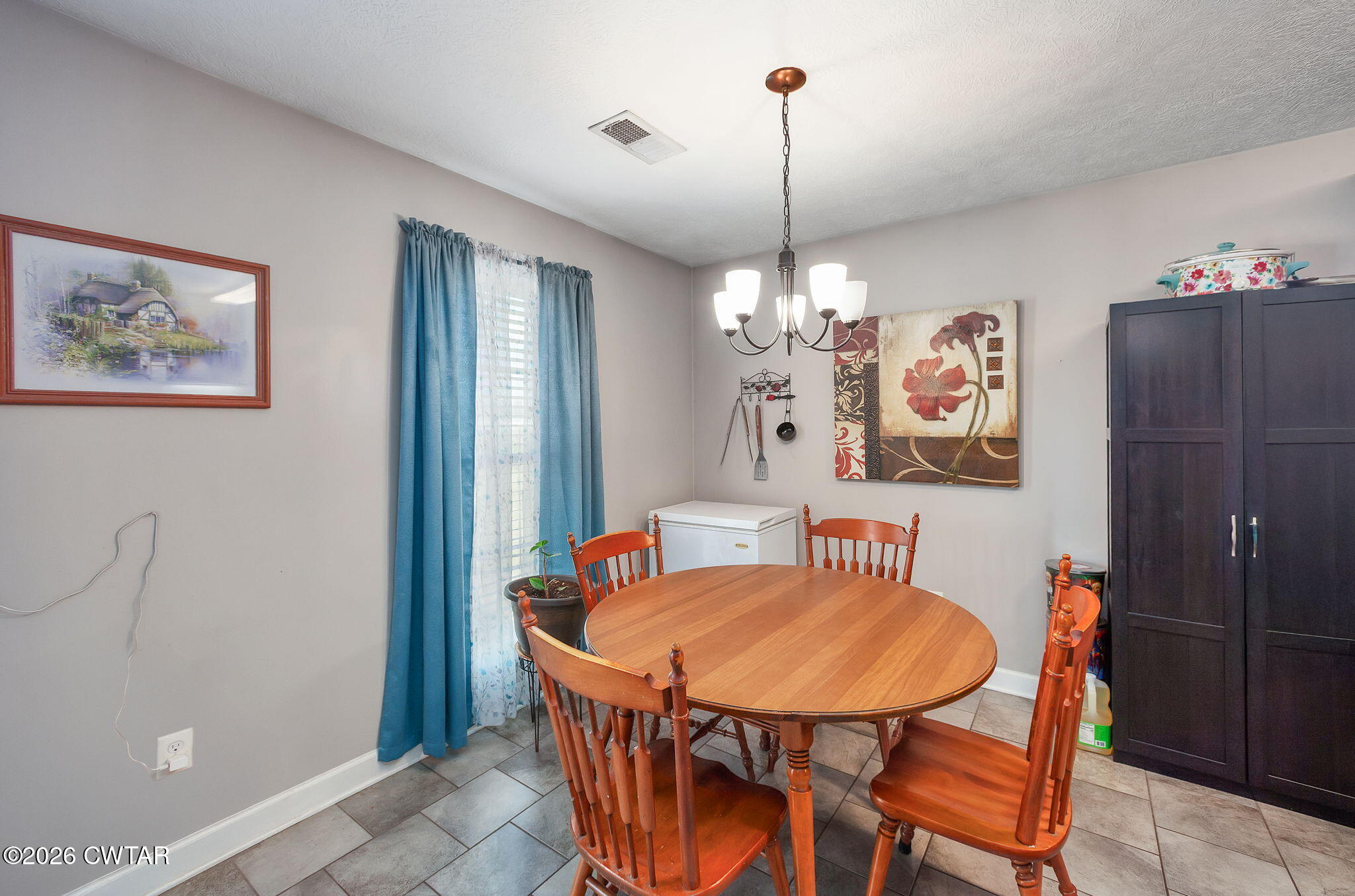 255 Taylor Drive Bells, TN 38006 - Photo 4 of 28 a view of a dining room with furniture and chandelier