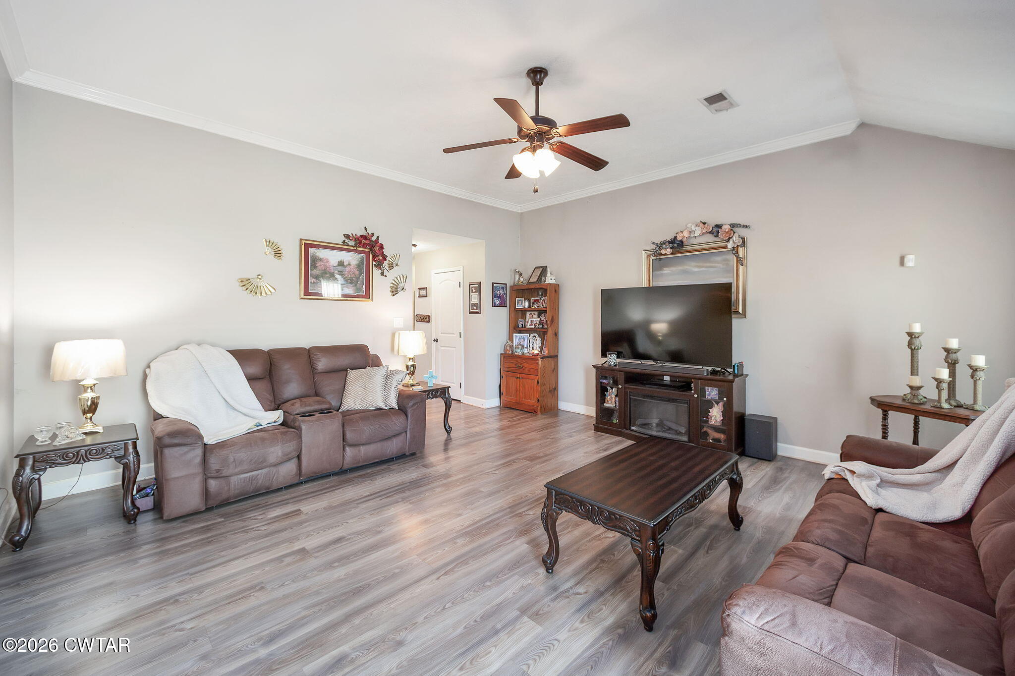 255 Taylor Drive Bells, TN 38006 - Photo 6 of 28 a living room with furniture and a flat screen tv