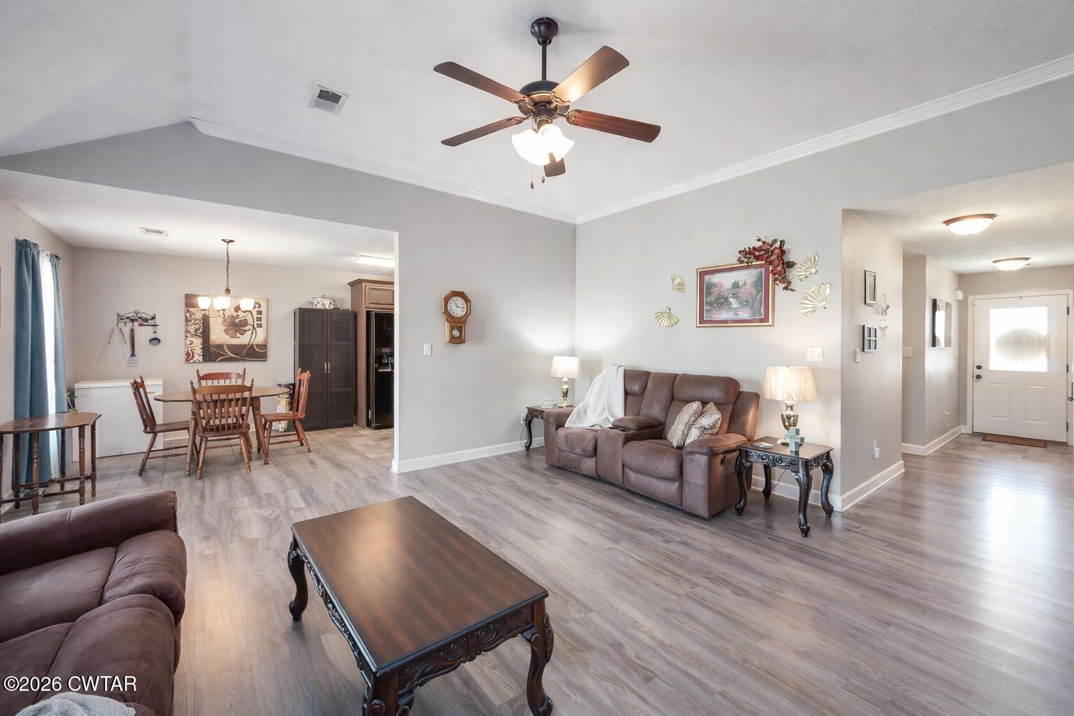 255 Taylor Drive Bells, TN 38006 - Photo 7 of 28 a living room with furniture and wooden floor