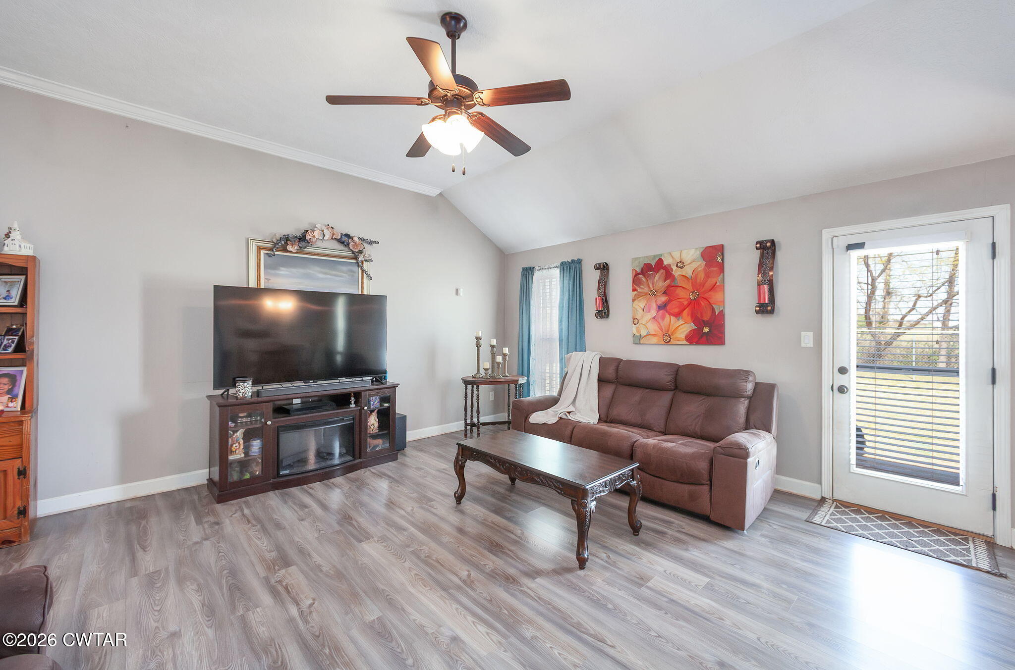 255 Taylor Drive Bells, TN 38006 - Photo 9 of 28 a living room with furniture and a flat screen tv