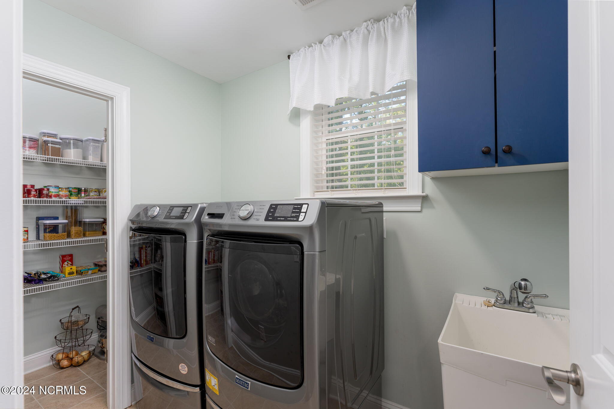 135 Holly Hill Road Hampstead, NC 28443 - Photo 15 of 52 Laundry area with pantry