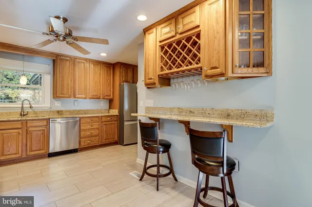a kitchen with a sink cabinets and window
