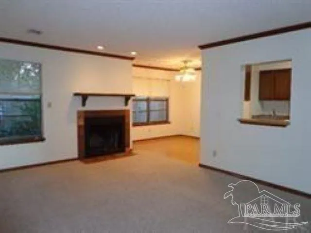 a view of an empty room with a fireplace