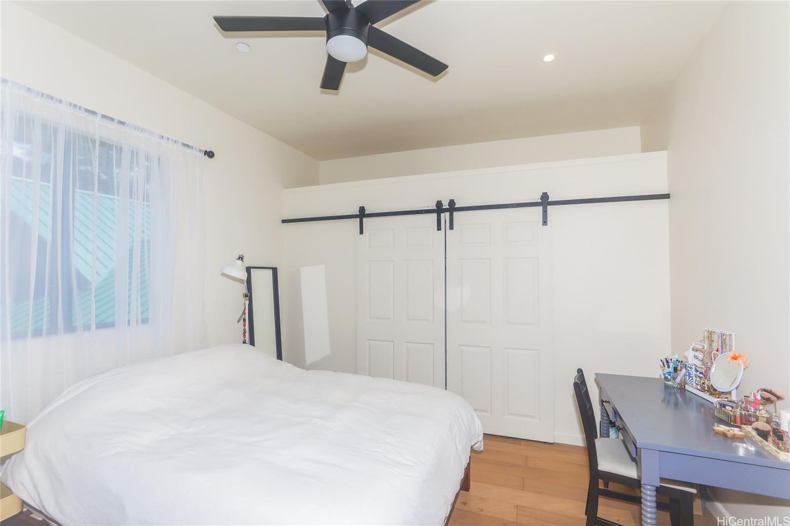 3702 Old Pali Road Honolulu, HI 96817 - Photo 14 of 25 a bedroom with a bed and a table