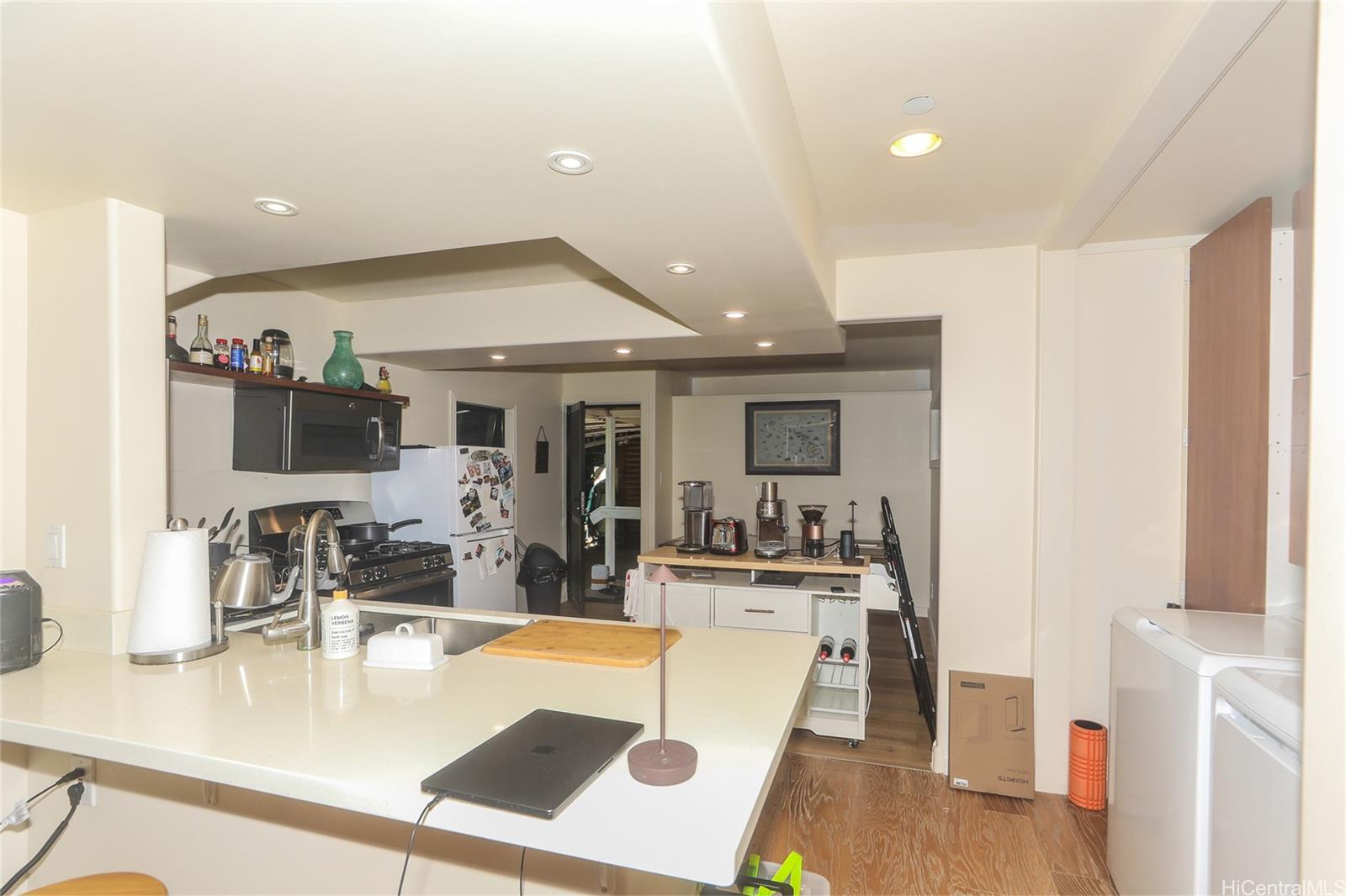 3702 Old Pali Road Honolulu, HI 96817 - Photo 19 of 25 a living room with furniture and a flat screen tv