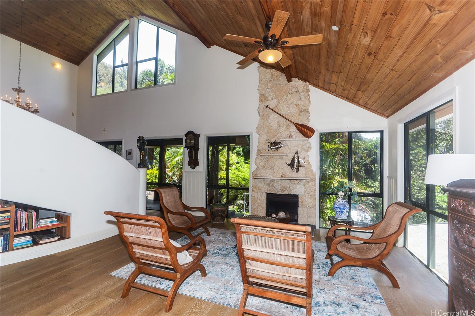 3702 Old Pali Road Honolulu, HI 96817 - Photo 3 of 25 a living room with furniture a fireplace and a large window