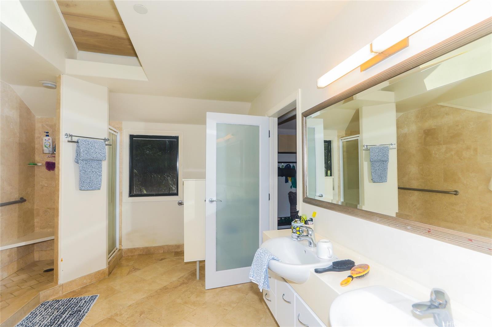 3702 Old Pali Road Honolulu, HI 96817 - Photo 8 of 25 a spacious bathroom with a tub shower and sink
