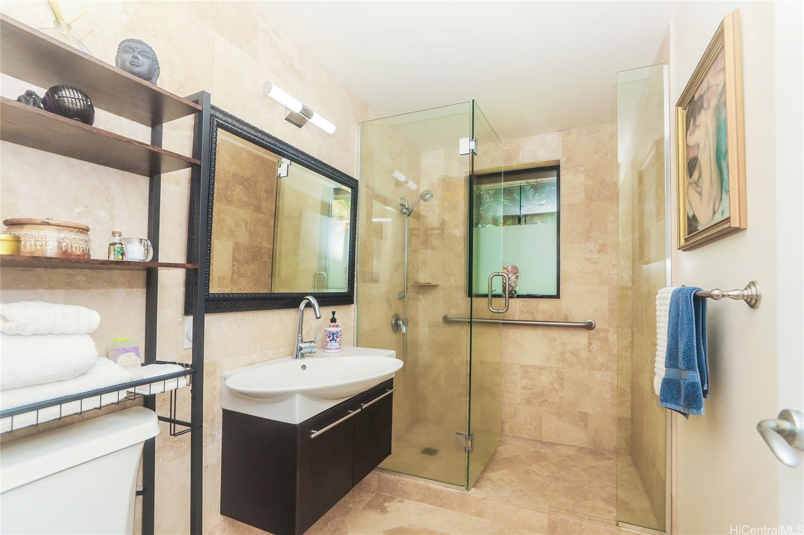 3702 Old Pali Road Honolulu, HI 96817 - Photo 10 of 25 a bathroom with a sink and a mirror