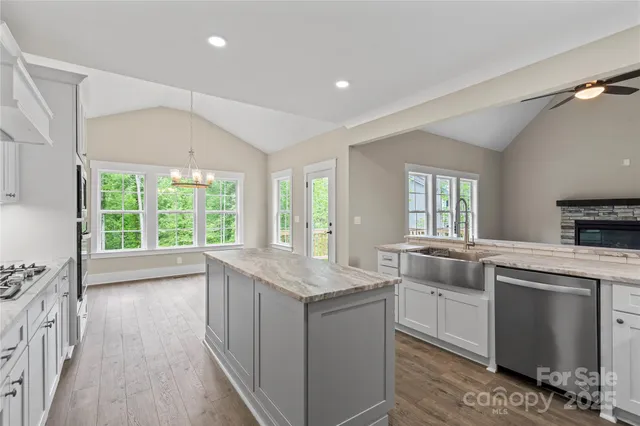 a kitchen with sink cabinets and window