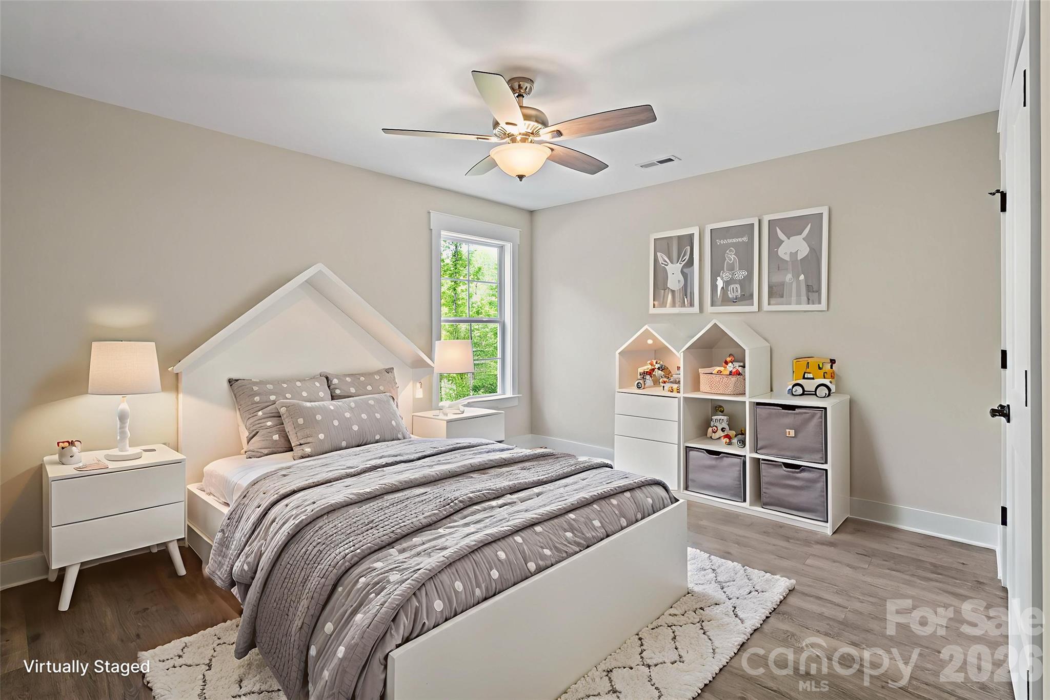 156 Clear Springs Road Mooresville, NC 28115 - Photo 18 of 28 a bedroom with a bed and a chandelier