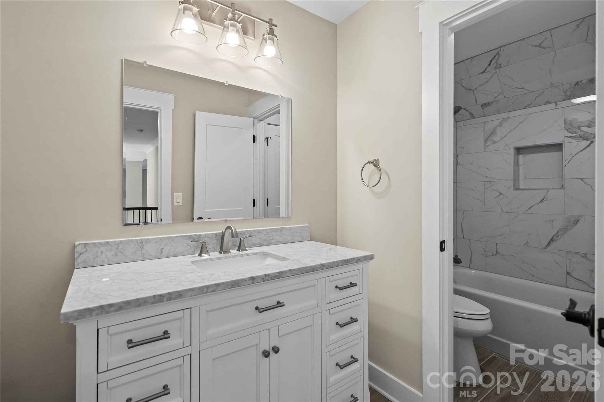 156 Clear Springs Road Mooresville, NC 28115 - Photo 20 of 28 a bathroom with a granite countertop sink toilet and shower