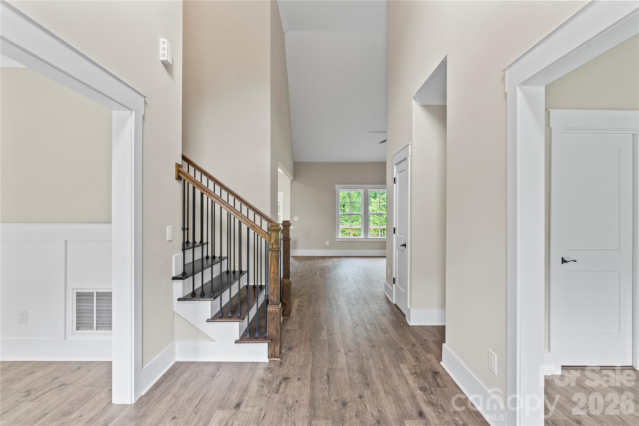 156 Clear Springs Road Mooresville, NC 28115 - Photo 2 of 28 a view of a hallway with wooden floor and stairs