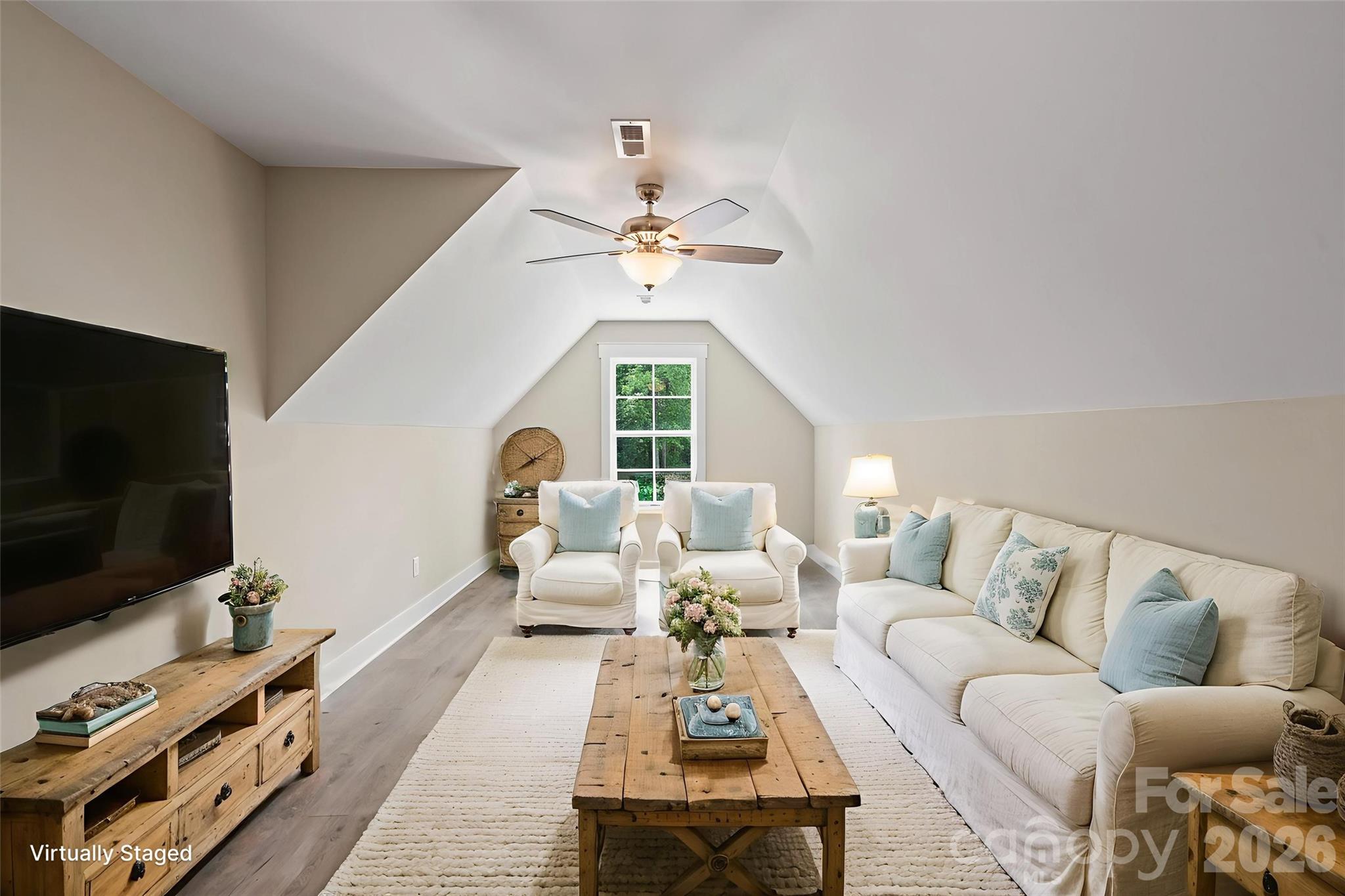 156 Clear Springs Road Mooresville, NC 28115 - Photo 23 of 28 a living room with furniture a flat screen tv and a window