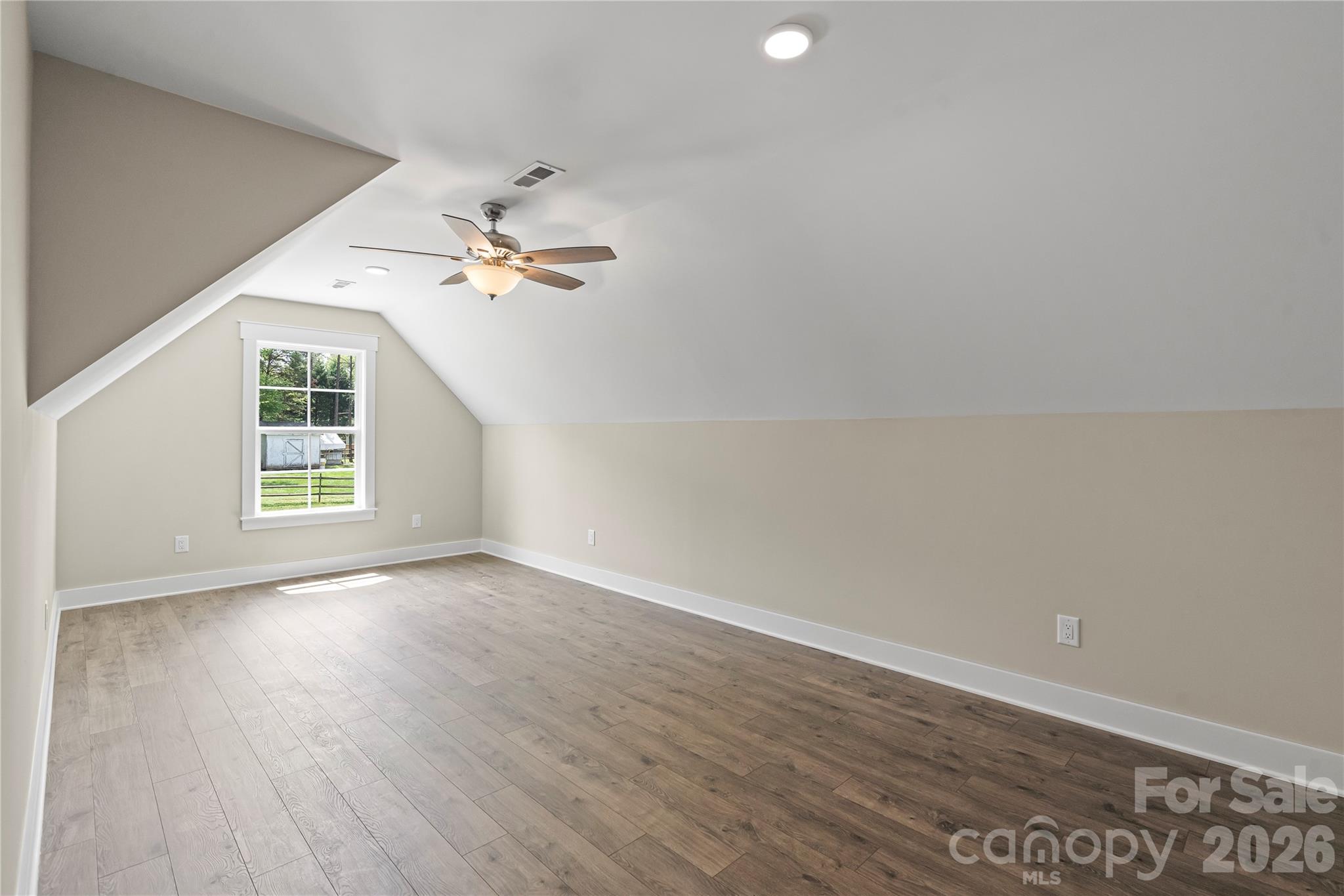 156 Clear Springs Road Mooresville, NC 28115 - Photo 24 of 28 wooden floor in an empty room with a window