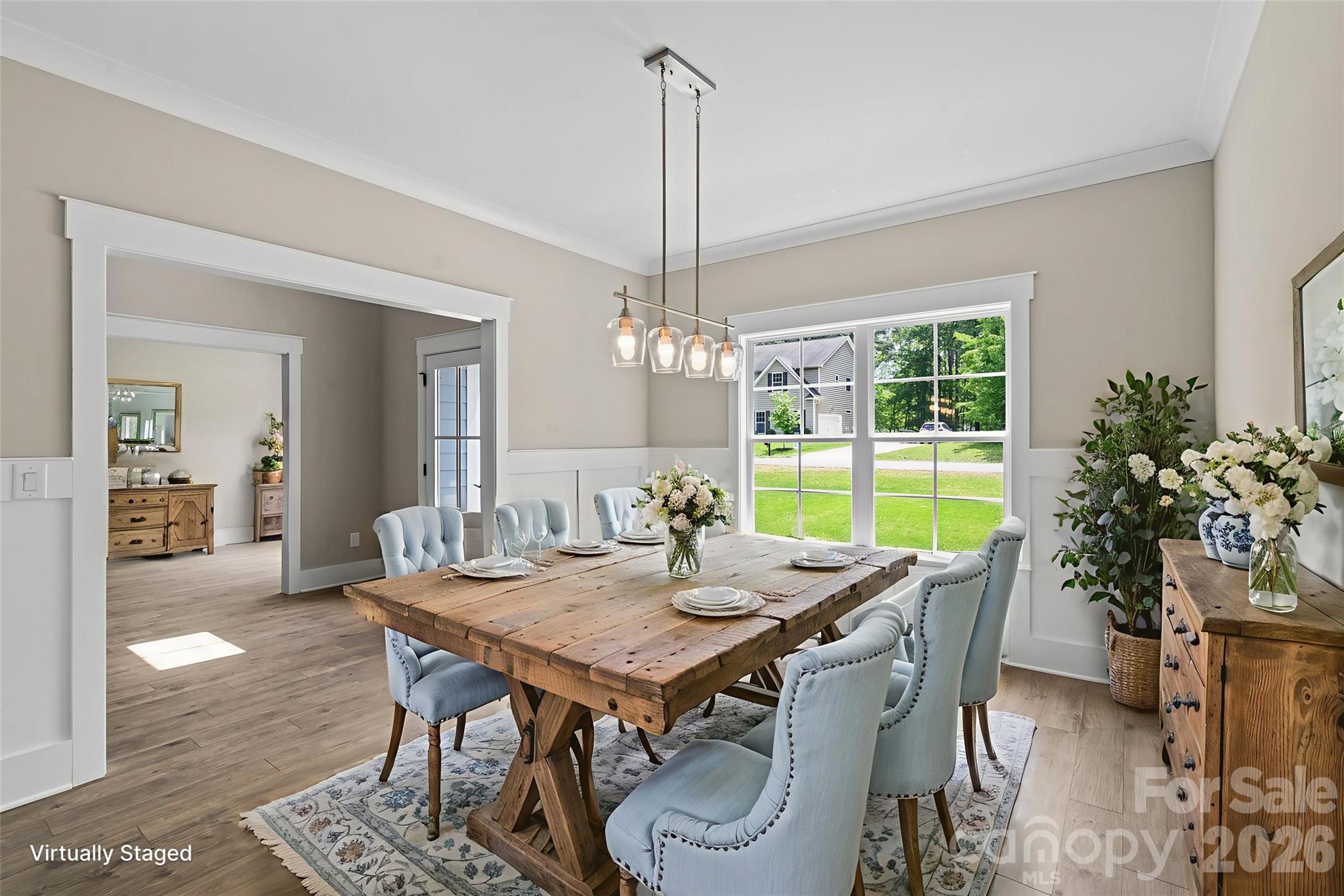 156 Clear Springs Road Mooresville, NC 28115 - Photo 3 of 28 a view of a dining room with furniture window and wooden floor