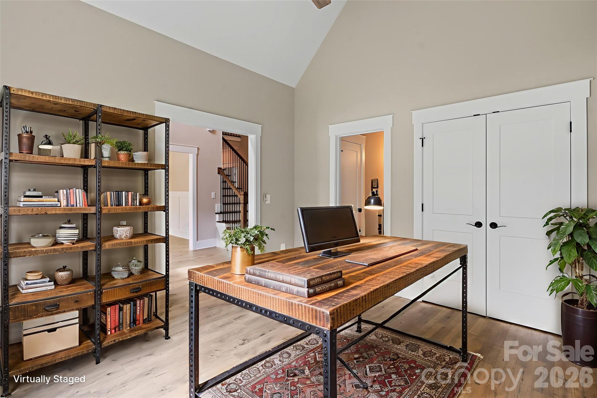 156 Clear Springs Road Mooresville, NC 28115 - Photo 4 of 28 a view of a workspace with furniture and a bookshelf