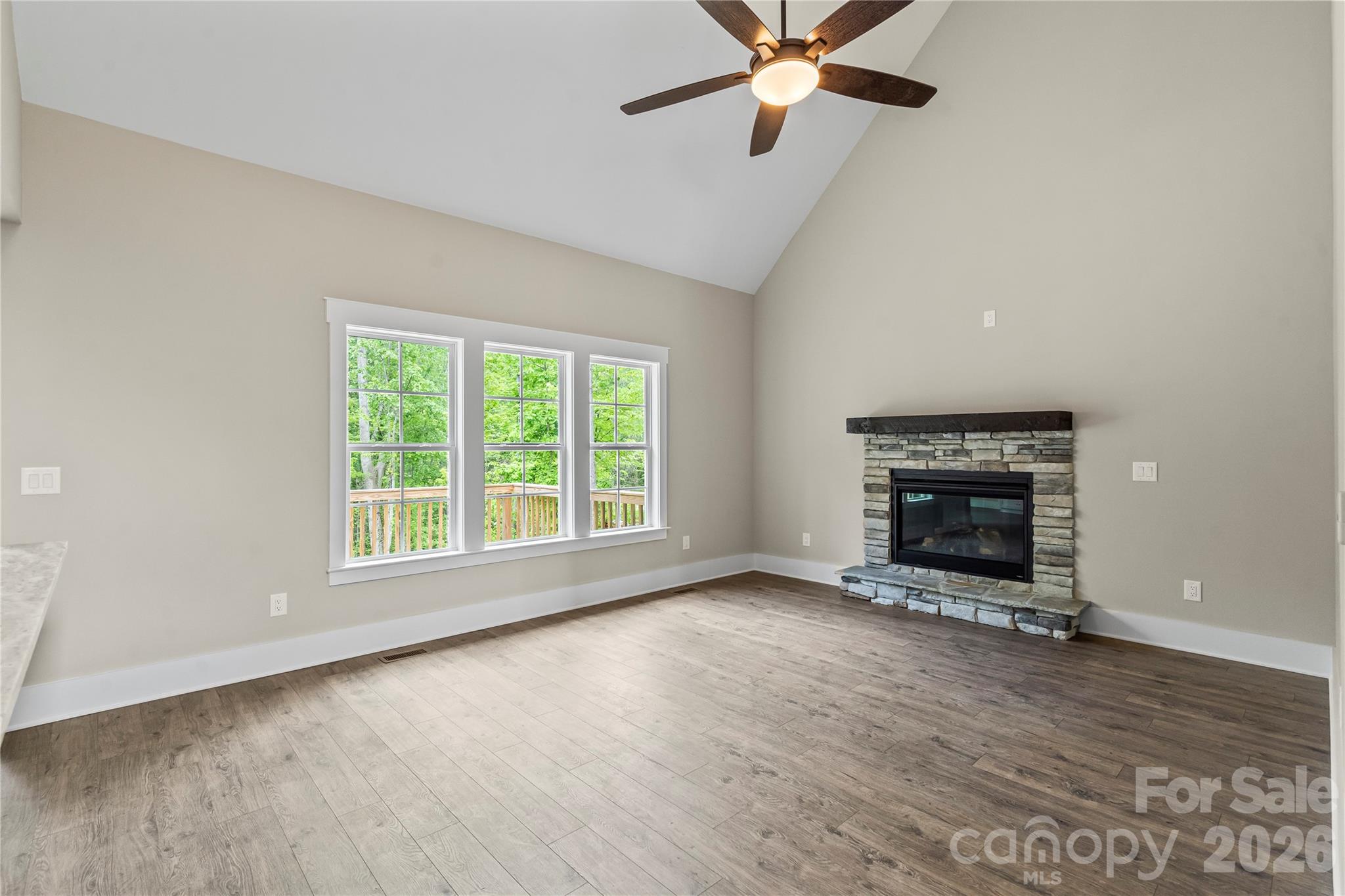 156 Clear Springs Road Mooresville, NC 28115 - Photo 8 of 28 wooden floor fireplace and windows in an empty room