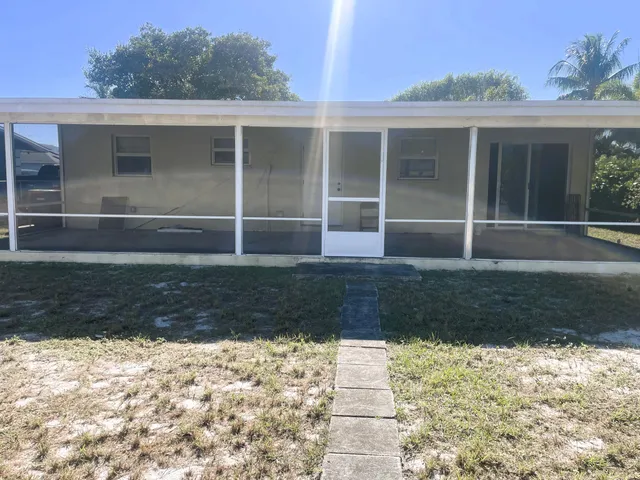 a view of a swimming pool with an outdoor space and seating area