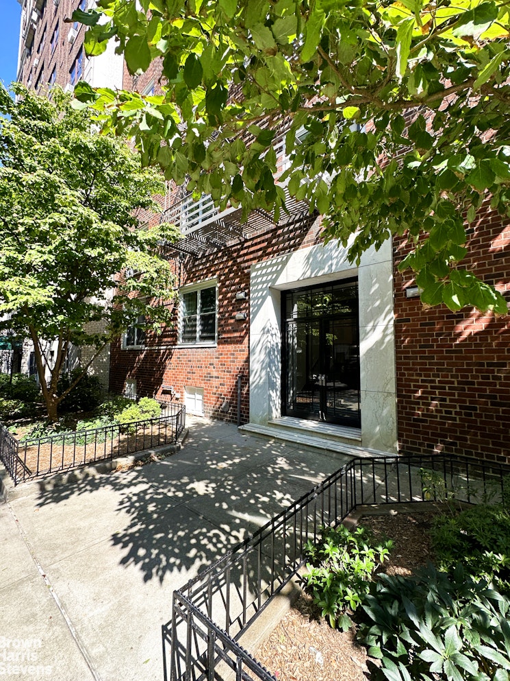 30 Monroe Place, Unit 1F Brooklyn, NY 11201 - Photo 6 of 7 a view of a house with a tree