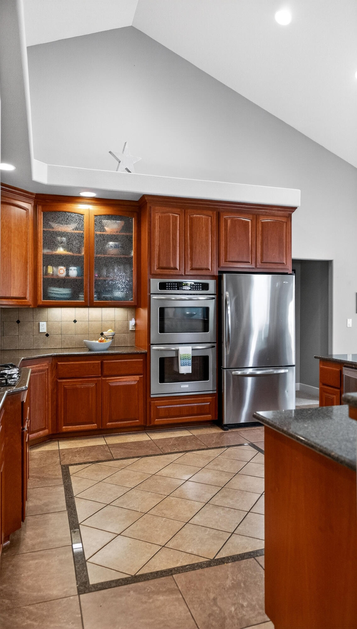 10421 Kestrel Road Klamath Falls, OR 97601 - Photo 23 of 56 a kitchen with stainless steel appliances granite countertop a stove a sink and a microwave
