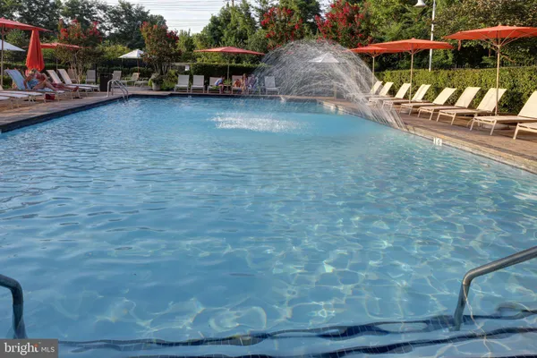 a outdoor sitting area with furniture and wooden floor