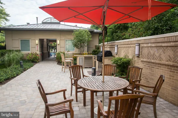 a view of a dinning table and chairs in the patio