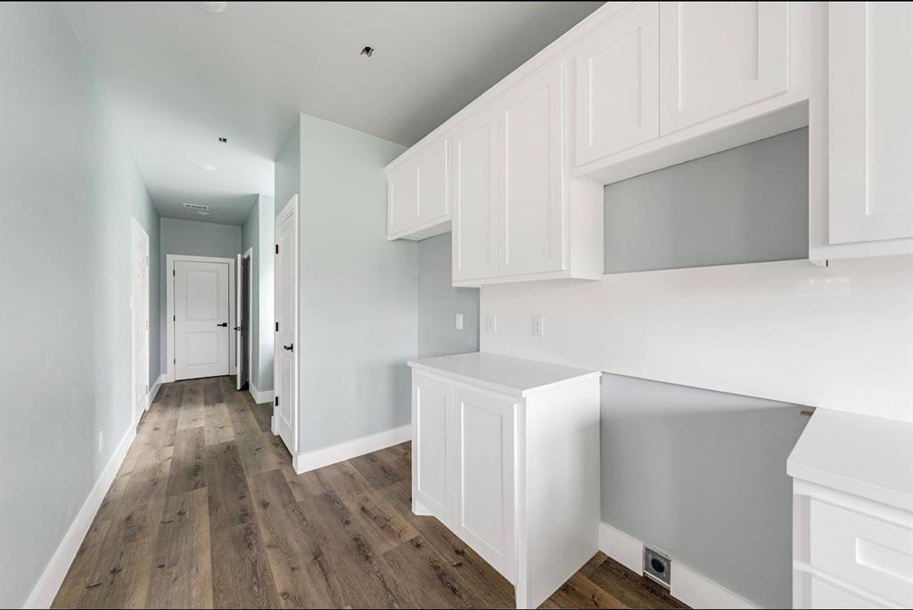 1113 East Oleander Street Fort Worth, TX 76104 - Photo 15 of 39 Hall with dark wood finished floors