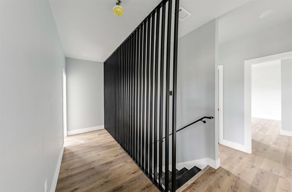 1113 East Oleander Street Fort Worth, TX 76104 - Photo 21 of 39 Staircase with wood finished floors