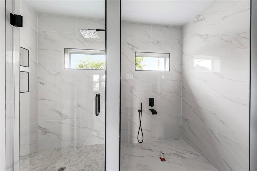 1113 East Oleander Street Fort Worth, TX 76104 - Photo 33 of 39 Bathroom featuring a marble finish shower