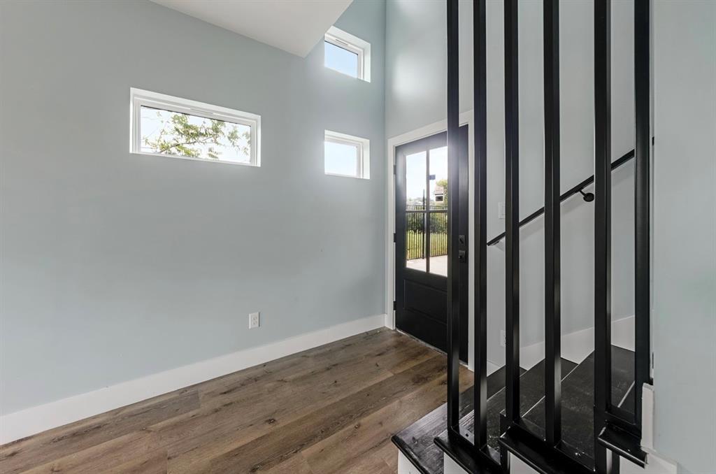1113 East Oleander Street Fort Worth, TX 76104 - Photo 8 of 39 Entrance foyer with wood finished floors and a high ceiling