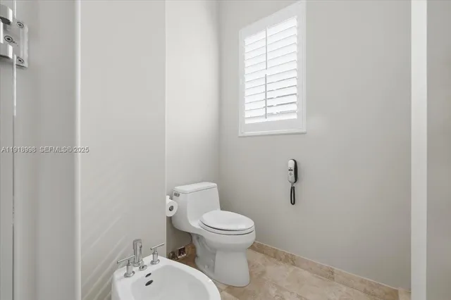 a spacious bathroom with a granite countertop sink and a mirror