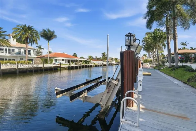 a view of a lake with a table and chairs