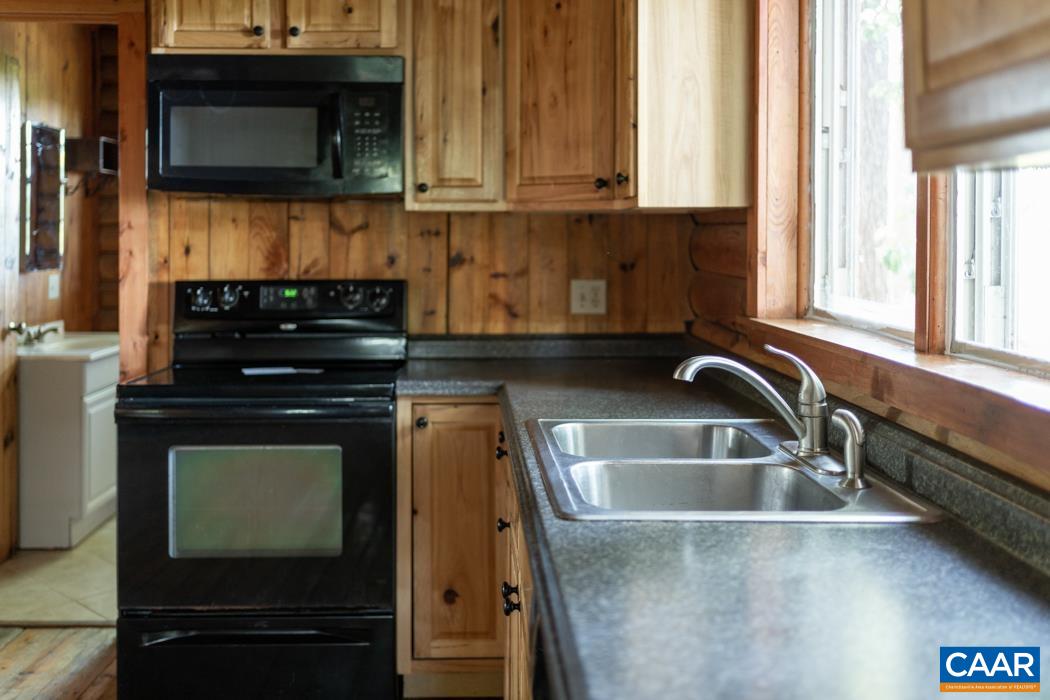 45 Middle Lane Road Grottoes, VA 24441 - Photo 2 of 64 a kitchen with a sink and a microwave