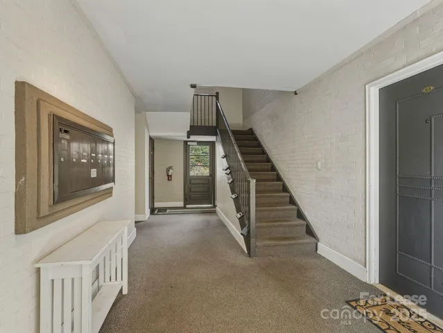 a view of an entryway with a hallway