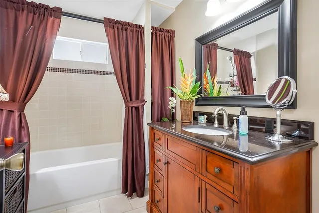 a kitchen with stainless steel appliances granite countertop a sink a counter space and a window