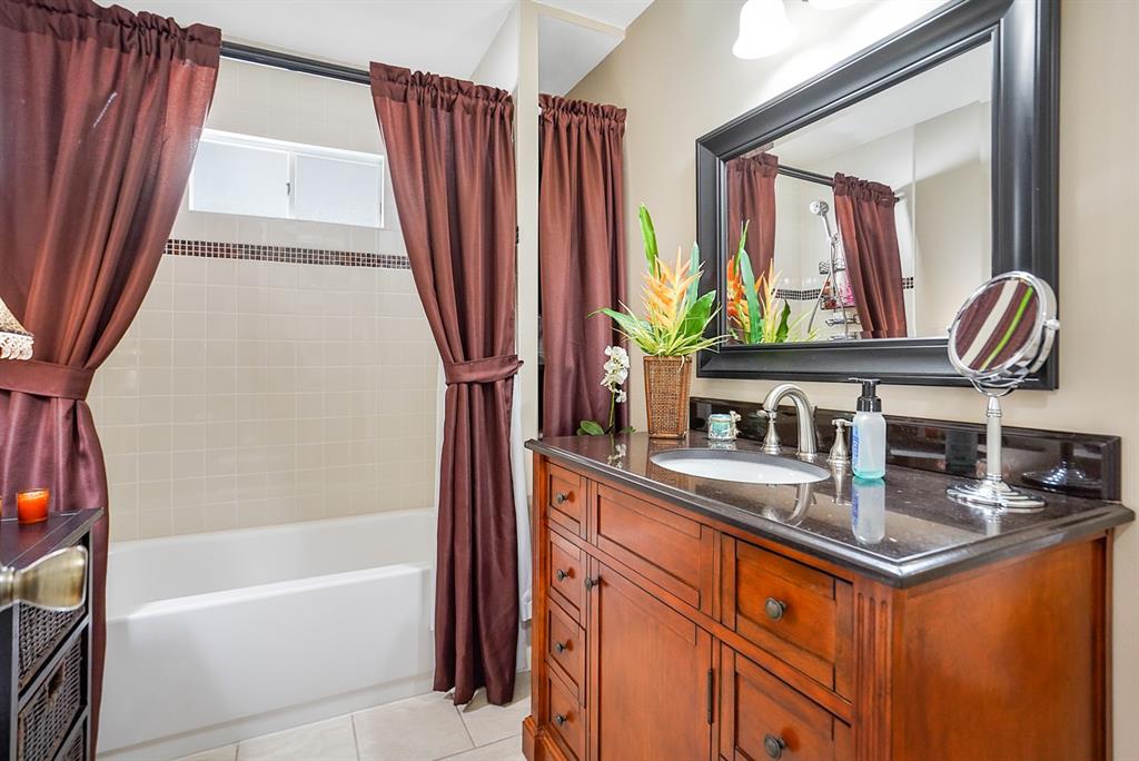 1830 Southwest 83rd Avenue Davie, FL 33324 - Photo 11 of 33 a kitchen with stainless steel appliances granite countertop a sink a counter space and a window