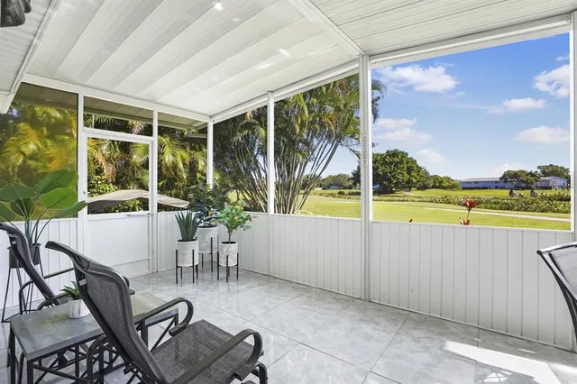 a view of swimming pool with seating space
