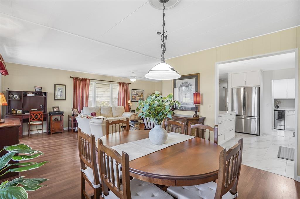 1830 Southwest 83rd Avenue Davie, FL 33324 - Photo 18 of 33 a view of a dining room with furniture window and wooden floor