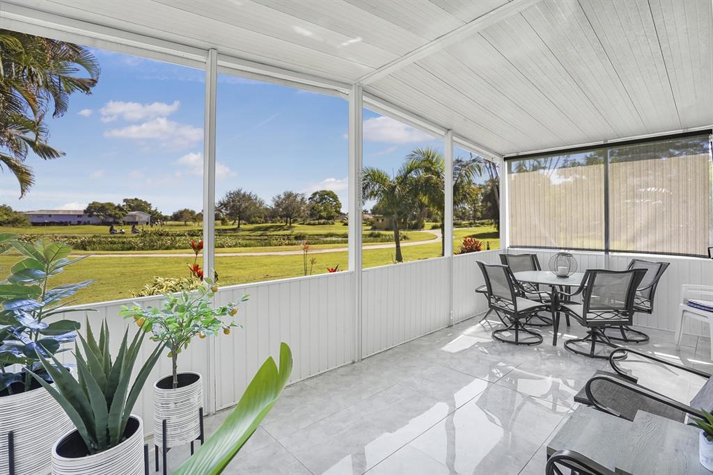 1830 Southwest 83rd Avenue Davie, FL 33324 - Photo 24 of 33 a view of a swimming pool with a table and chairs