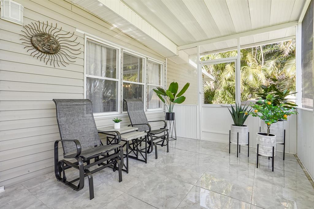 1830 Southwest 83rd Avenue Davie, FL 33324 - Photo 25 of 33 a view of a patio with table and chairs and potted plants