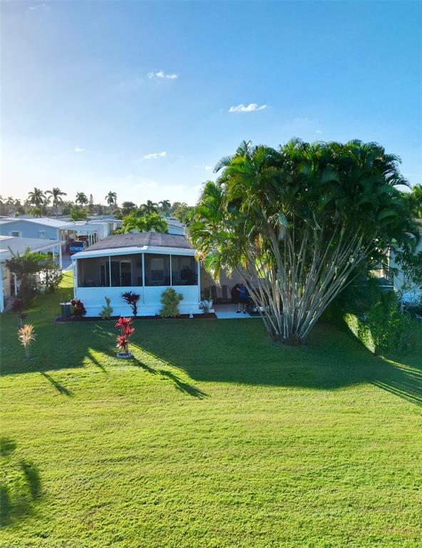 1830 Southwest 83rd Avenue Davie, FL 33324 - Photo 31 of 33 a view of a house with a yard