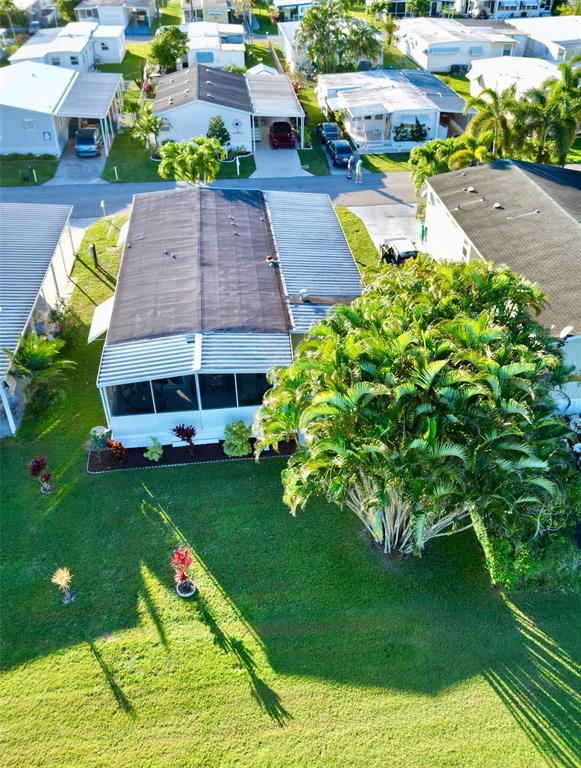 1830 Southwest 83rd Avenue Davie, FL 33324 - Photo 32 of 33 a front view of a house with garden